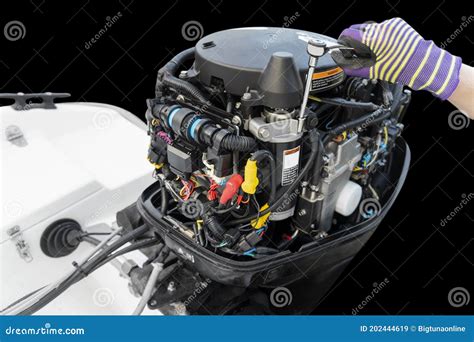 Outboard Motor Mechanic Working on Boat