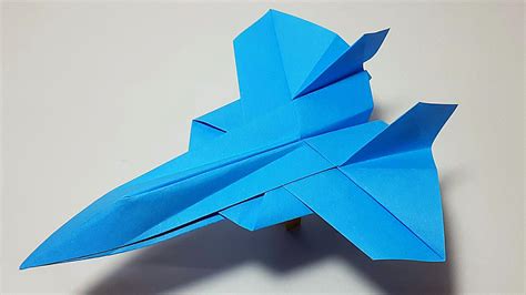 A paper airplane fighter jet on a table