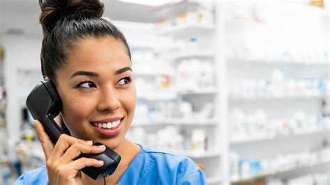 Pharmacy technician communicating with patients with limited English proficiency