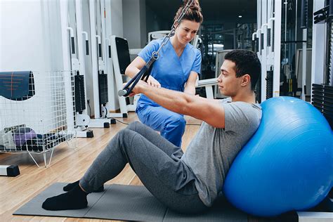 Physical Therapy Assistant helping a patient