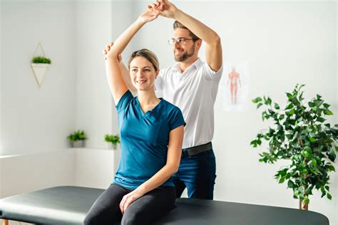 Physical therapy assistant working with a patient