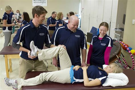 Physical therapy assistants communicating with patients