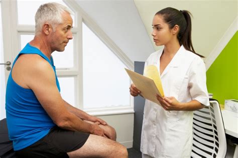 A physical therapist evaluating an Airman's injury