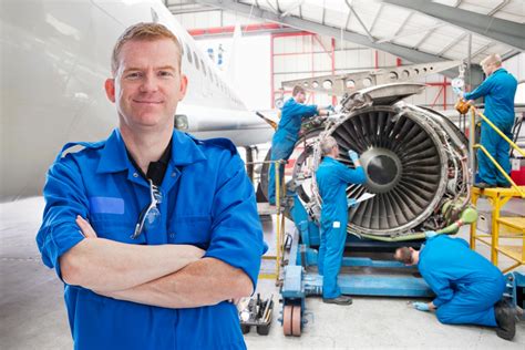 Plane engineers working on a aircraft engine