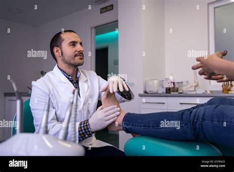 Podiatrist examining a patient's foot