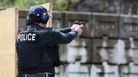 Police officer training with a pistol