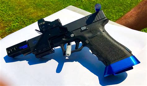 A selection of aftermarket components for a race gun