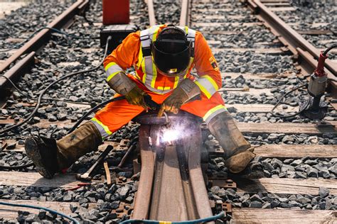 Welder working on a train