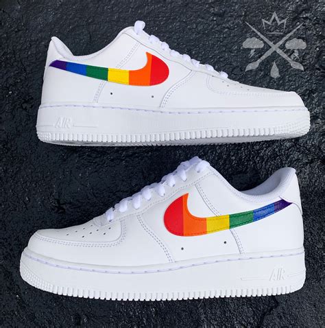 Rainbow Air Force 1 sneakers with distressed denim jeans and plain white t-shirt