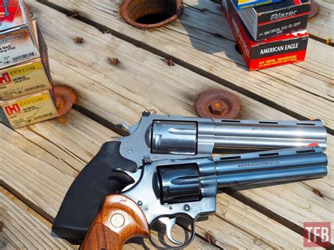 A person cleaning a 45 revolver handgun with maintenance tips