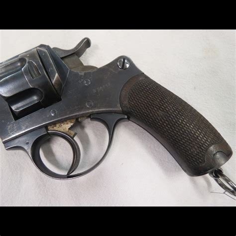 A person using a 45 revolver handgun