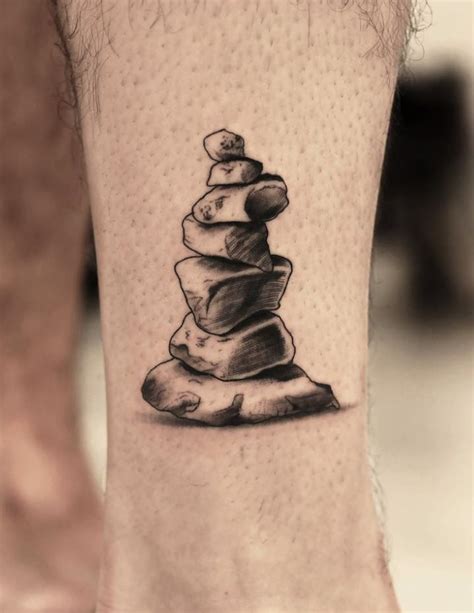 A person caring for their rock tattoo