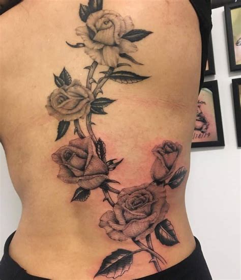 Rose vine tattoo on the leg