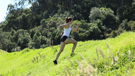 Runners sprinting up a hill