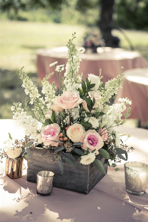 Rustic centerpiece with navy blue tablecloth