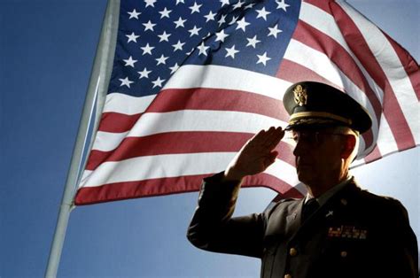 Military personnel saluting during a ceremony