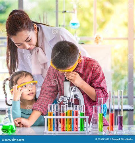 Scientists teaching and mentoring students in a classroom