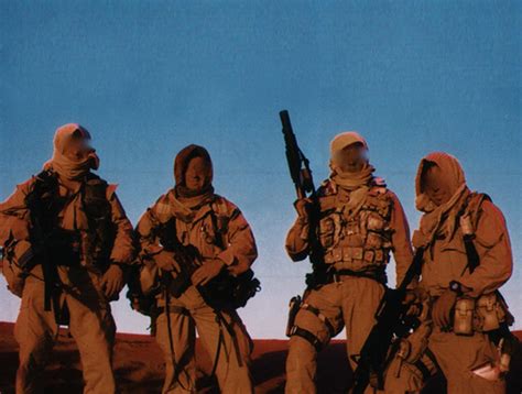 SEALs in the desert, conducting a mission