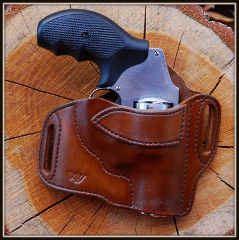 Self-defense revolver holsters