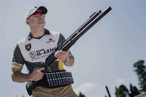 A competitor shooting a modified shotgun in a competition