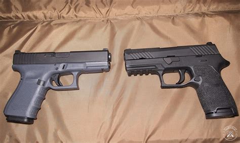 Sig Sauer and Glock handguns side by side