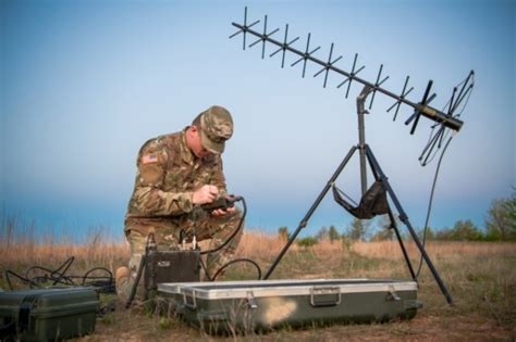 A signal support systems specialist working at a computer