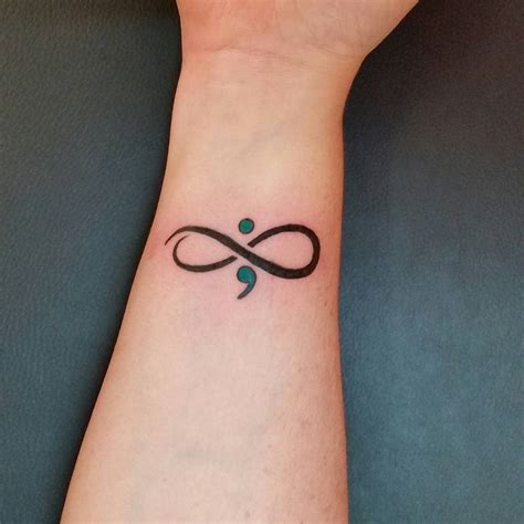 Simple symbol wrist tattoos