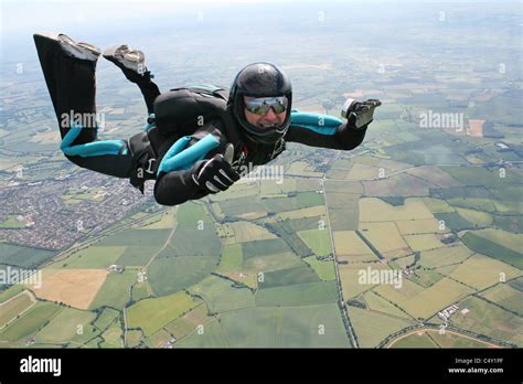 Skydiver in freefall, with a speedometer indicating terminal velocity