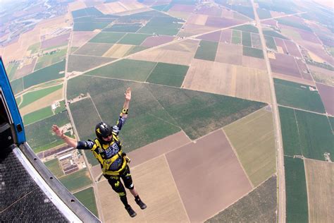 Skydiver in freefall, with a speedometer indicating terminal velocity