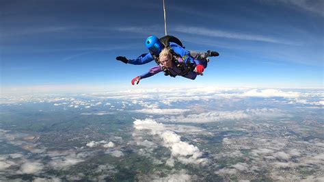 Skydiver in freefall, with a speedometer indicating terminal velocity