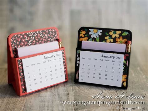 A collection of small desk calendars on a shelf