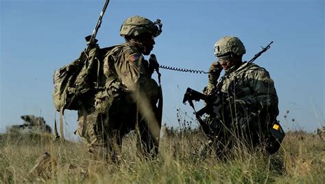 A soldier using military communications equipment