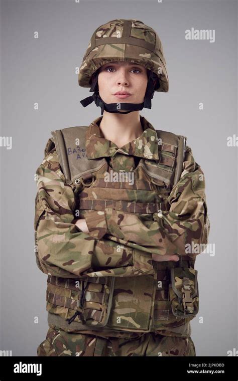 A soldier in uniform, with a determined look on their face