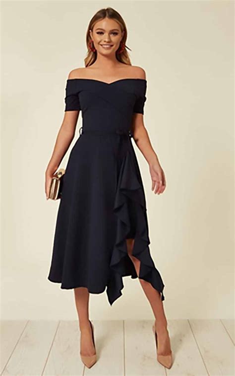 Styling navy wedding guest dresses