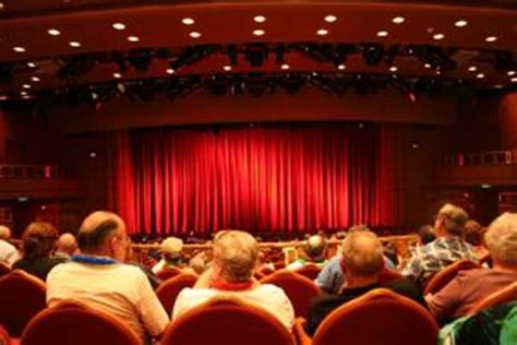 A crowd of people watching a live theater performance