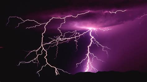 Lightning illuminating a dark sky