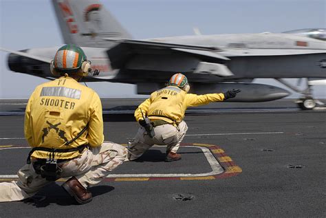 Top Gun Pilot Walking on Carrier Deck