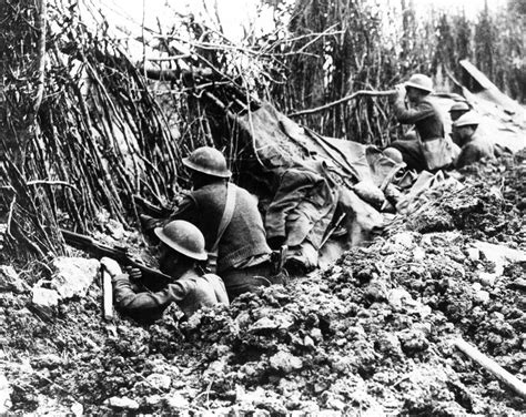 Soldiers in a trench with bayonets