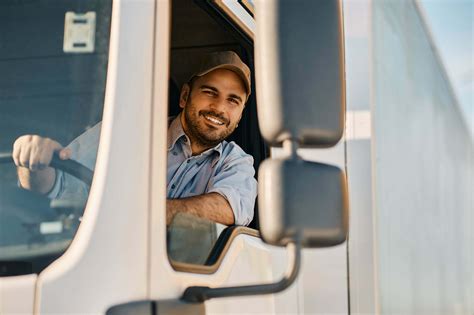 Truck driver inspecting vehicle