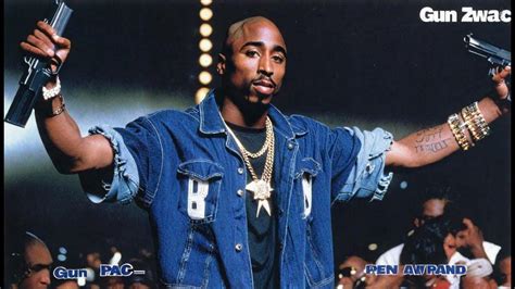 Tupac Shakur with a Gun