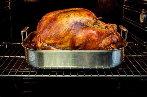 A picture of a roasted turkey on a table