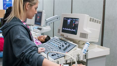 Ultrasound Technician performing cardiac sonography