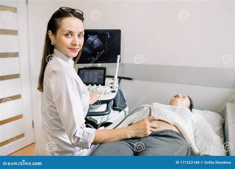 Ultrasound Technologist Examining Images