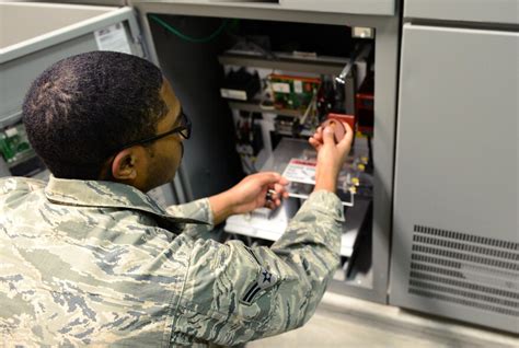 US Air Force Electrical Engineers working on a project