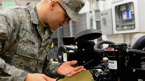 US Air Force Electrical Engineers working on a computer