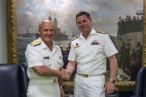 US and Australian naval personnel shaking hands