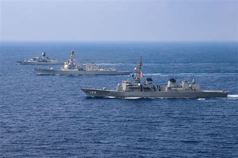 US and Australian naval personnel participating in training activities