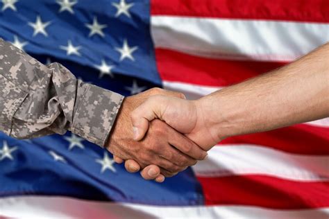 US soldier holding the American flag