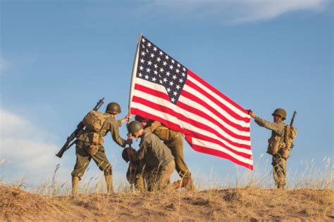 Soldiers marching with the flag