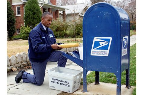 USPS Mail Carrier Delivering Mail